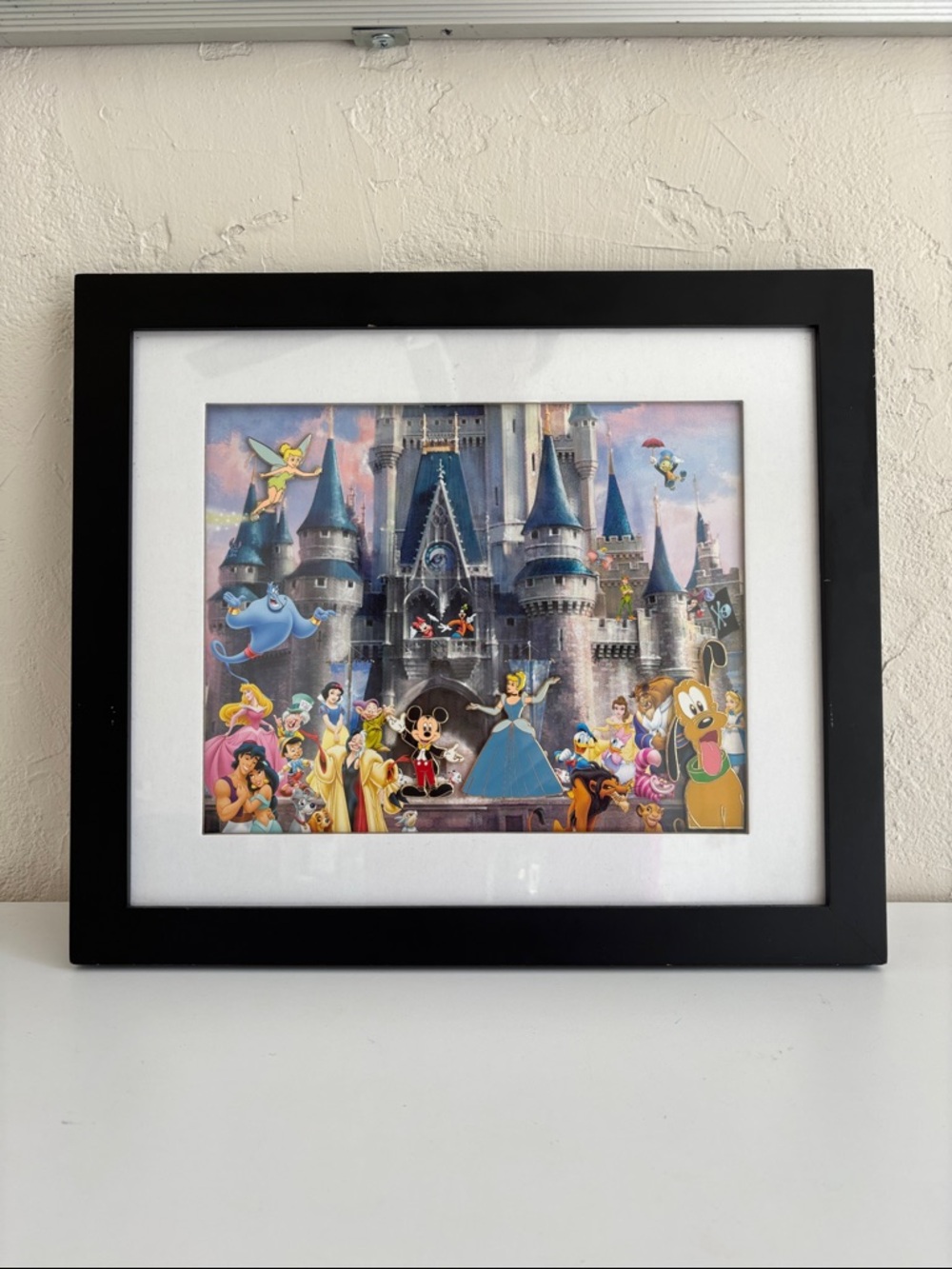 Disney Cinderella Castle lithograph print that includes four collectible pins
